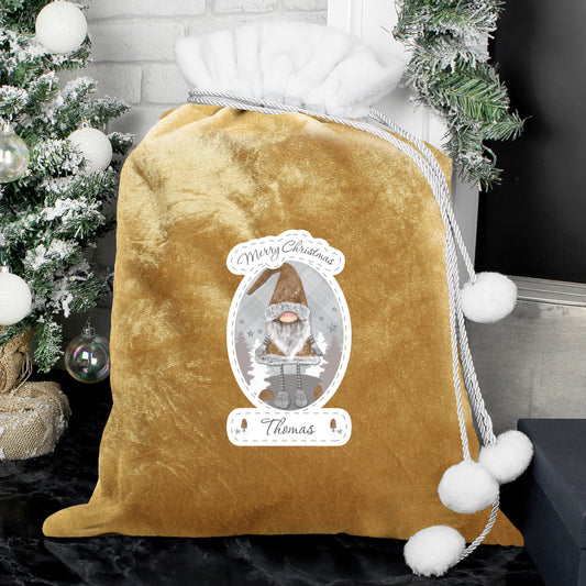 Personalised Gold velvet drawstring bag with Christmas-themed design and tree in the background
