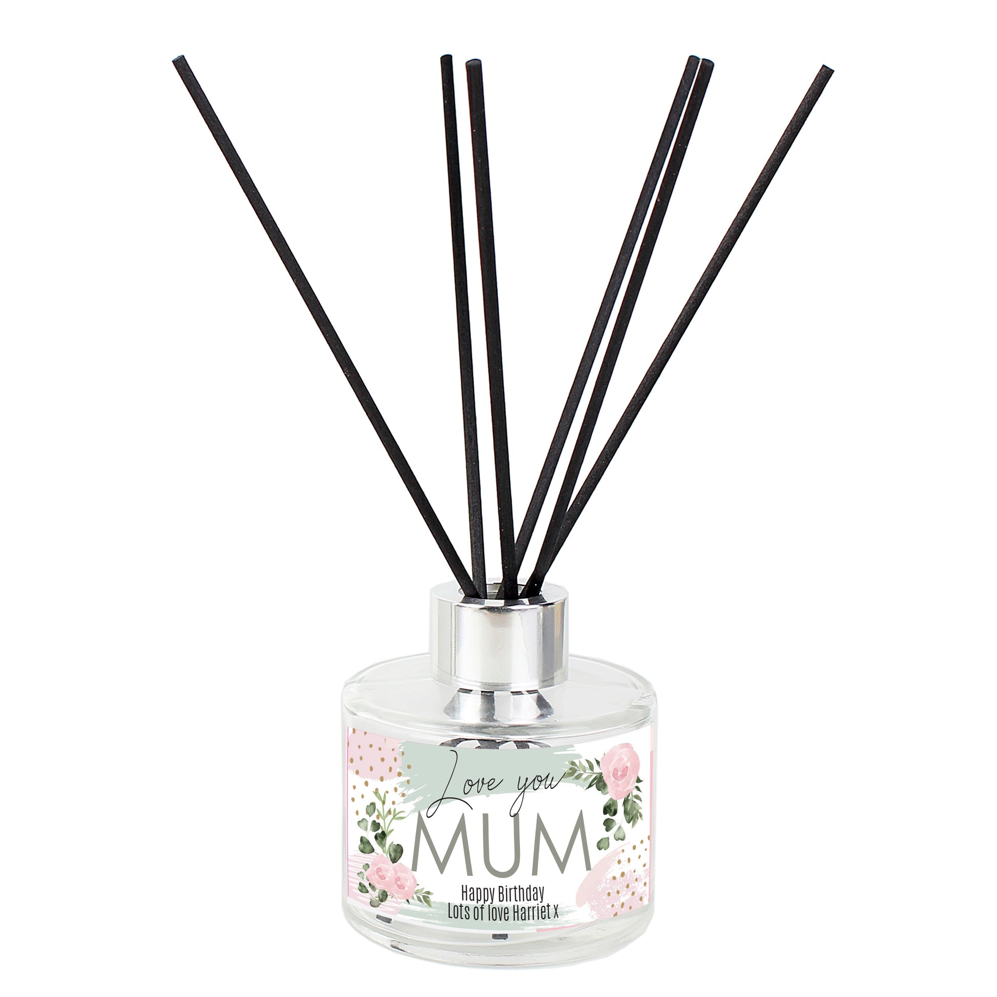 Reed diffuser with floral label on a white background