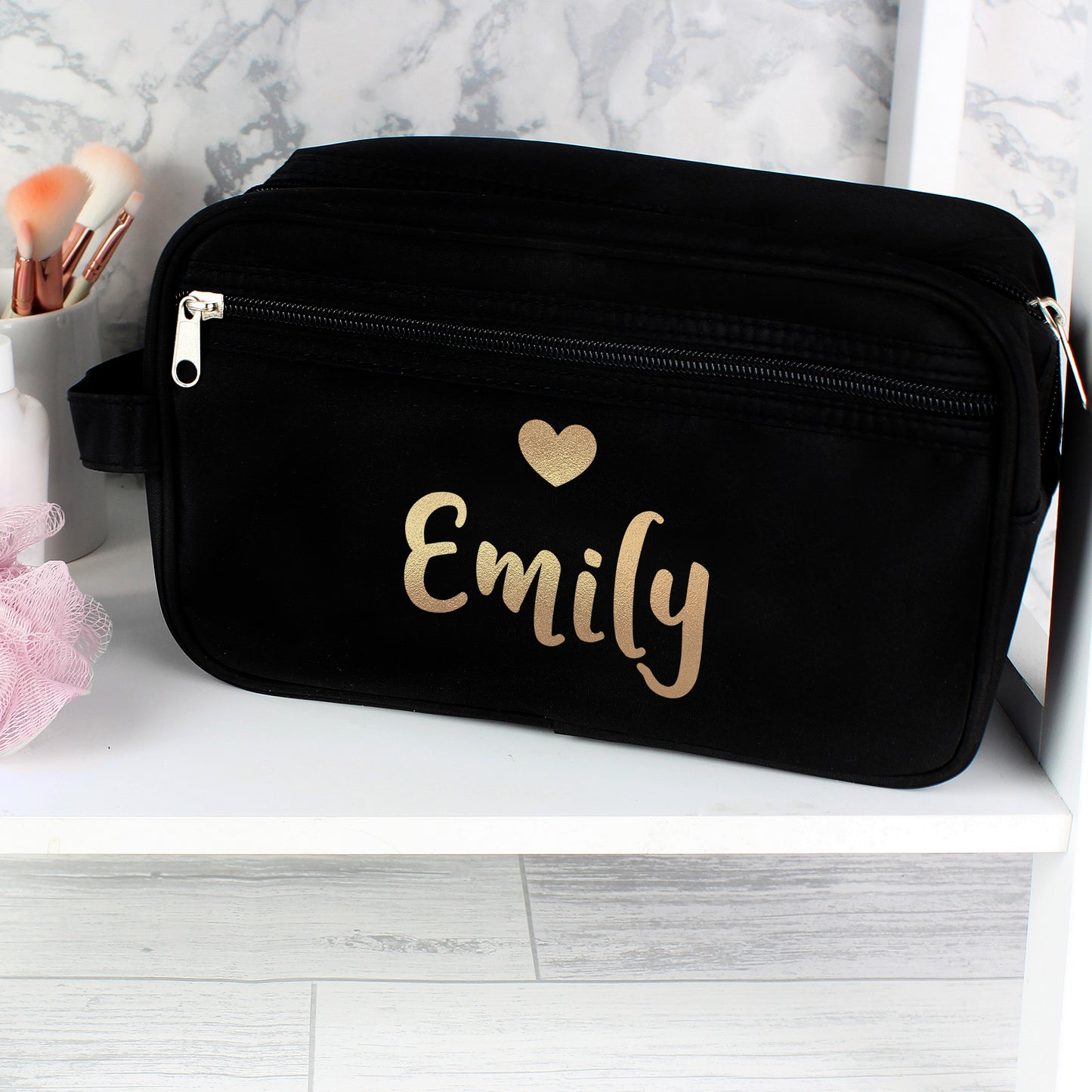Personalised Black bag with 'Emily' and a heart design on a white surface