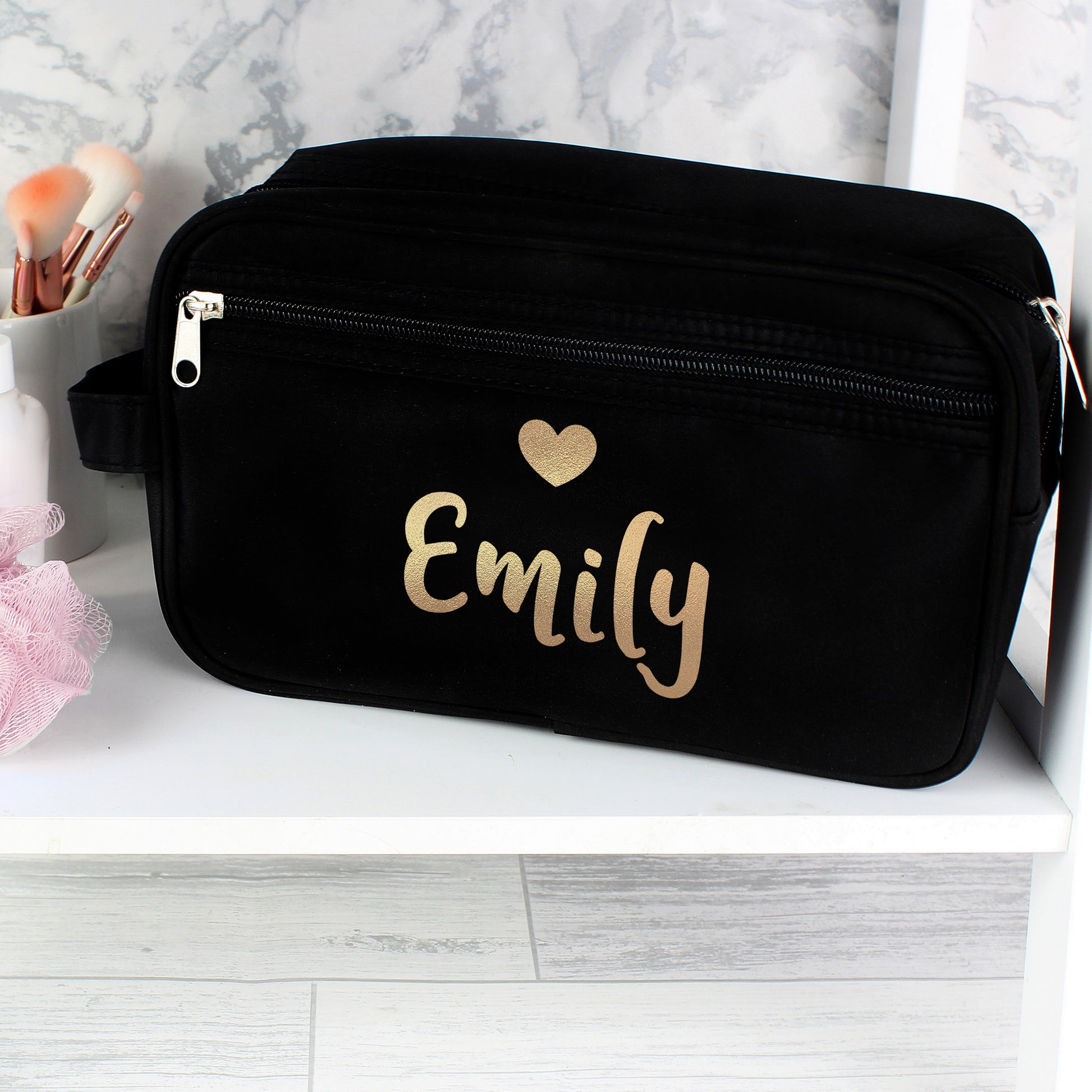 Personalised Black bag with 'Emily' and a heart design on a white surface