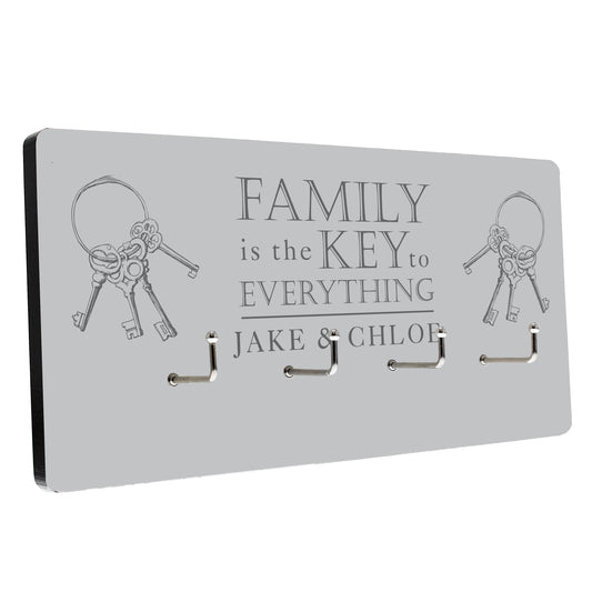 Personalised Key holder with decorative keys and engraved text on a white background