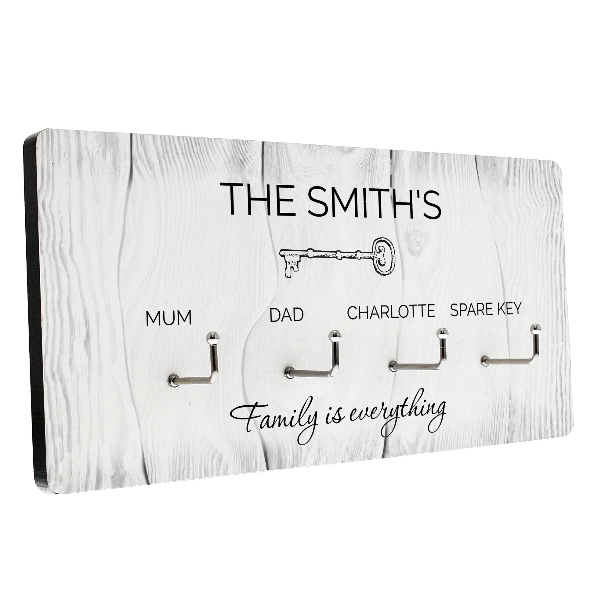 Key holder with hooks for keys, labeled 'The Smith's' and 'Family is everything', on a white background.