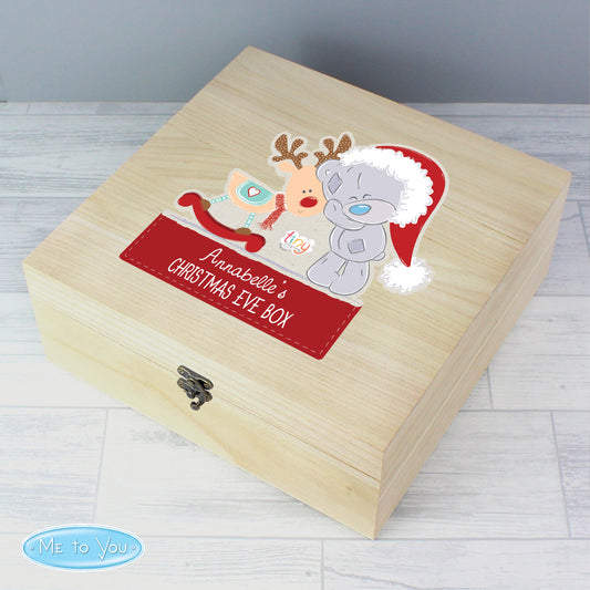 Wooden Christmas Eve box with cartoon characters and 'Me to You' branding on a light wooden floor.