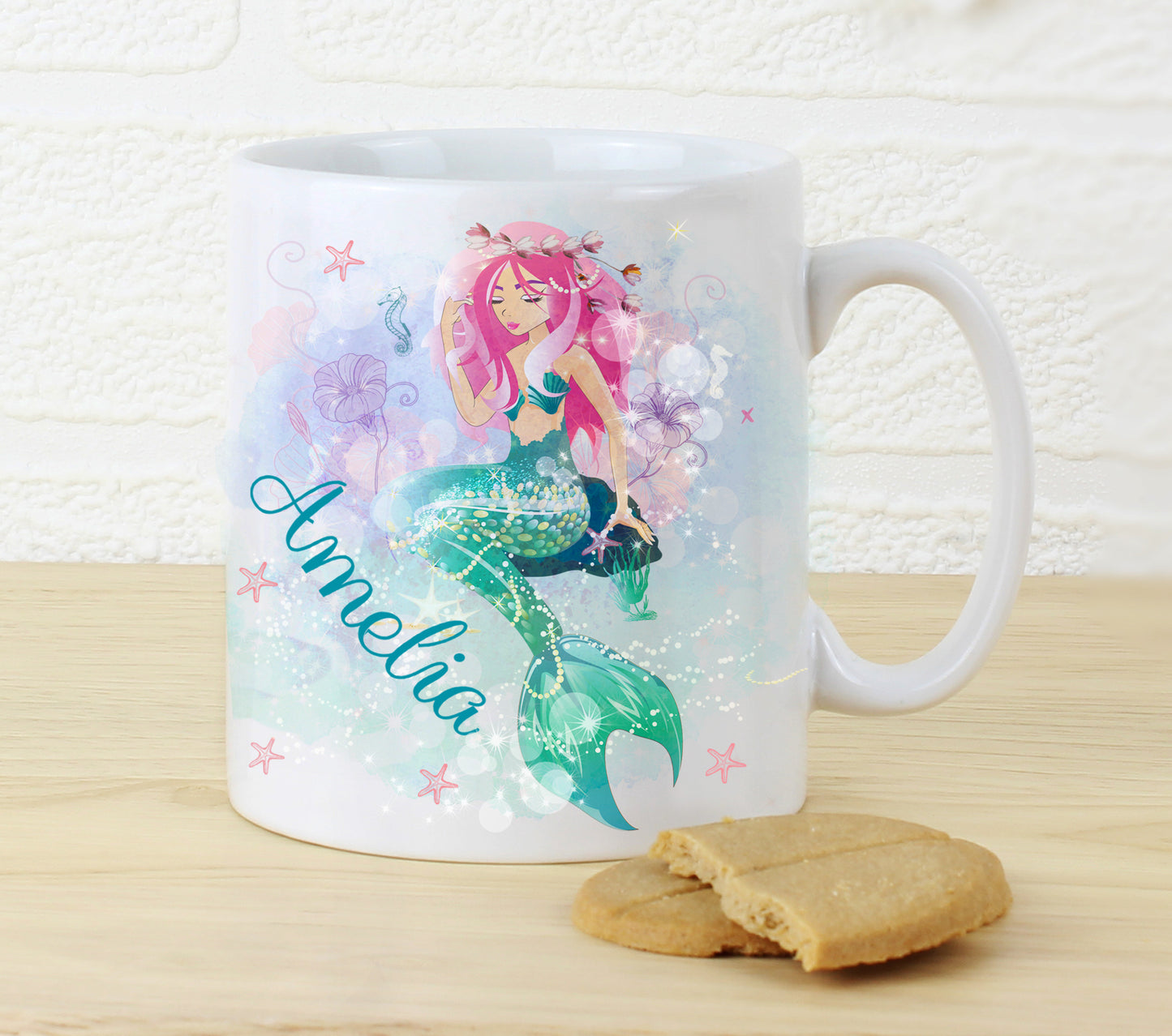 Mug with a mermaid design and the name 'Amelia' on a wooden surface with a light background