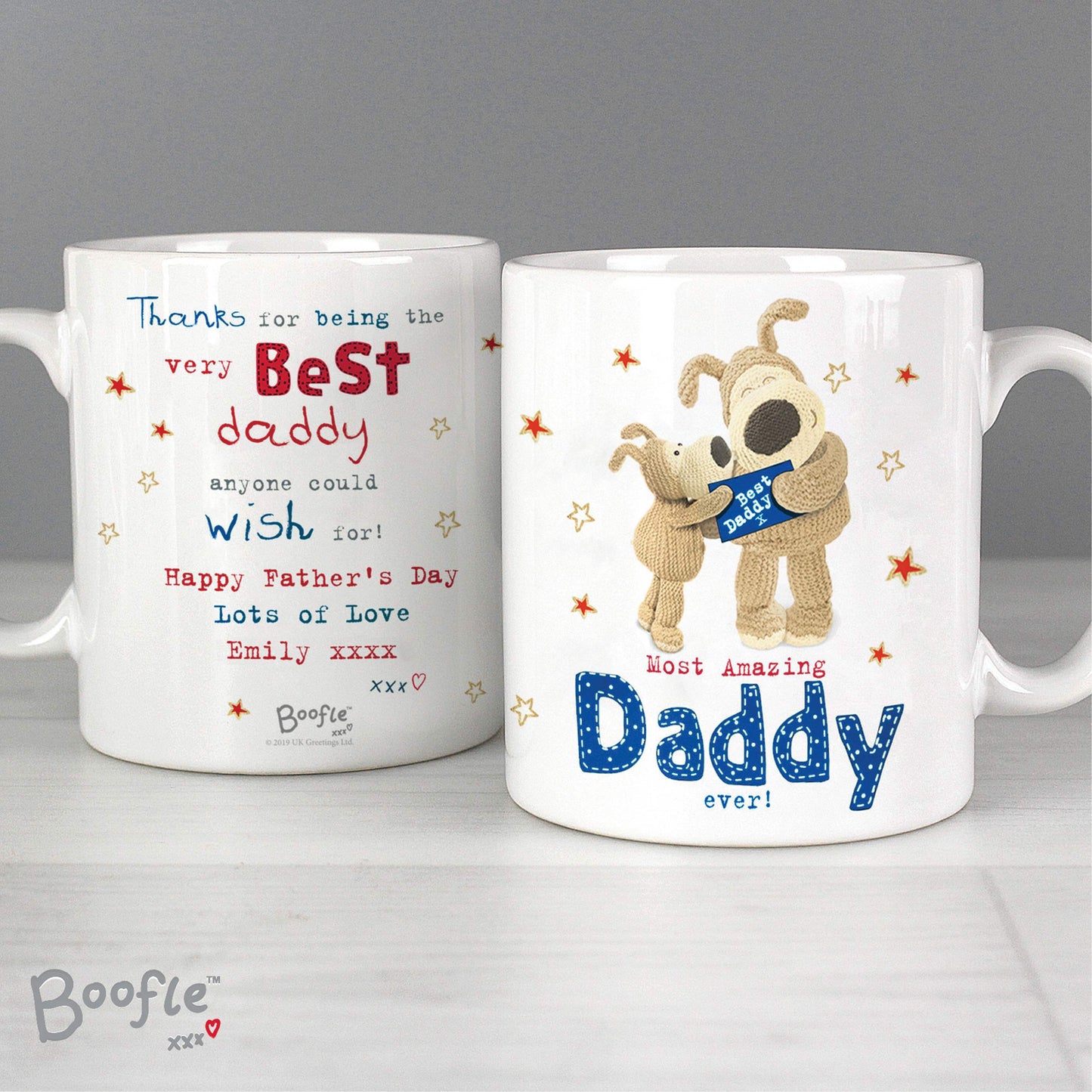 Two personalised mugs with Father's Day messages and a cartoon dog character on a gray background