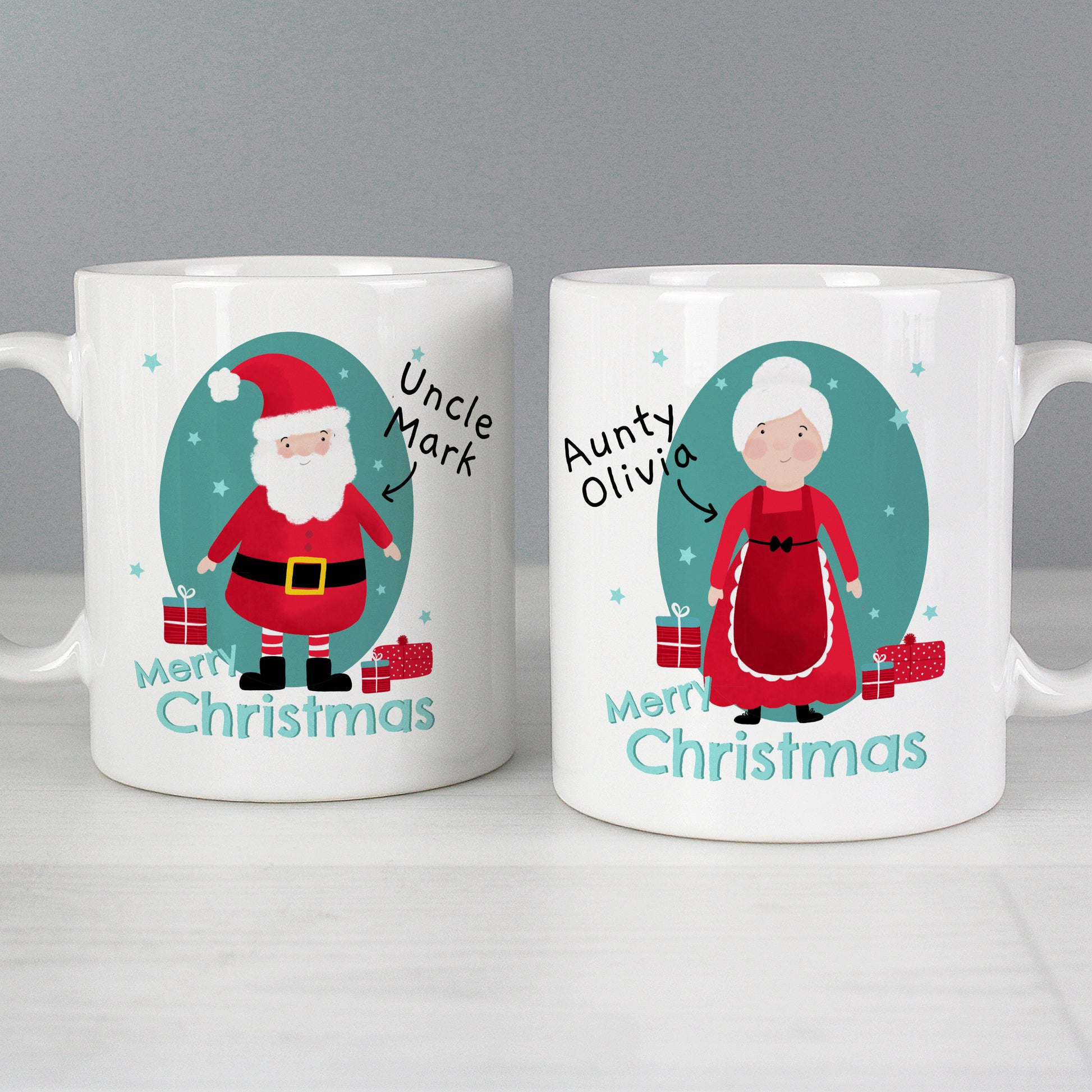 Two Christmas-themed mugs with illustrations of a man and a woman, labeled 'Uncle Mark' and 'Auntie Olivia', respectively.