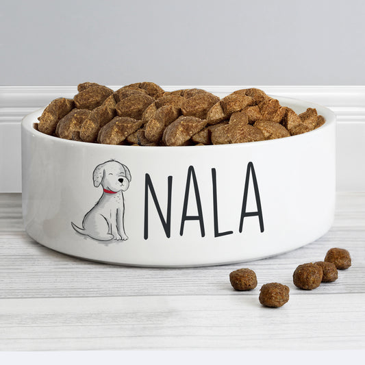Dog food bowl with 'Nala' and a dog illustration on a white surface