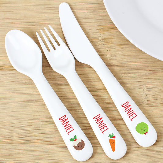 Personalised White cutlery set with 'DANIEL' branding on a wooden surface