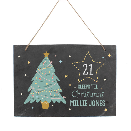 Decorative Christmas countdown sign with a tree and star, featuring the name 'Millie Jones'.