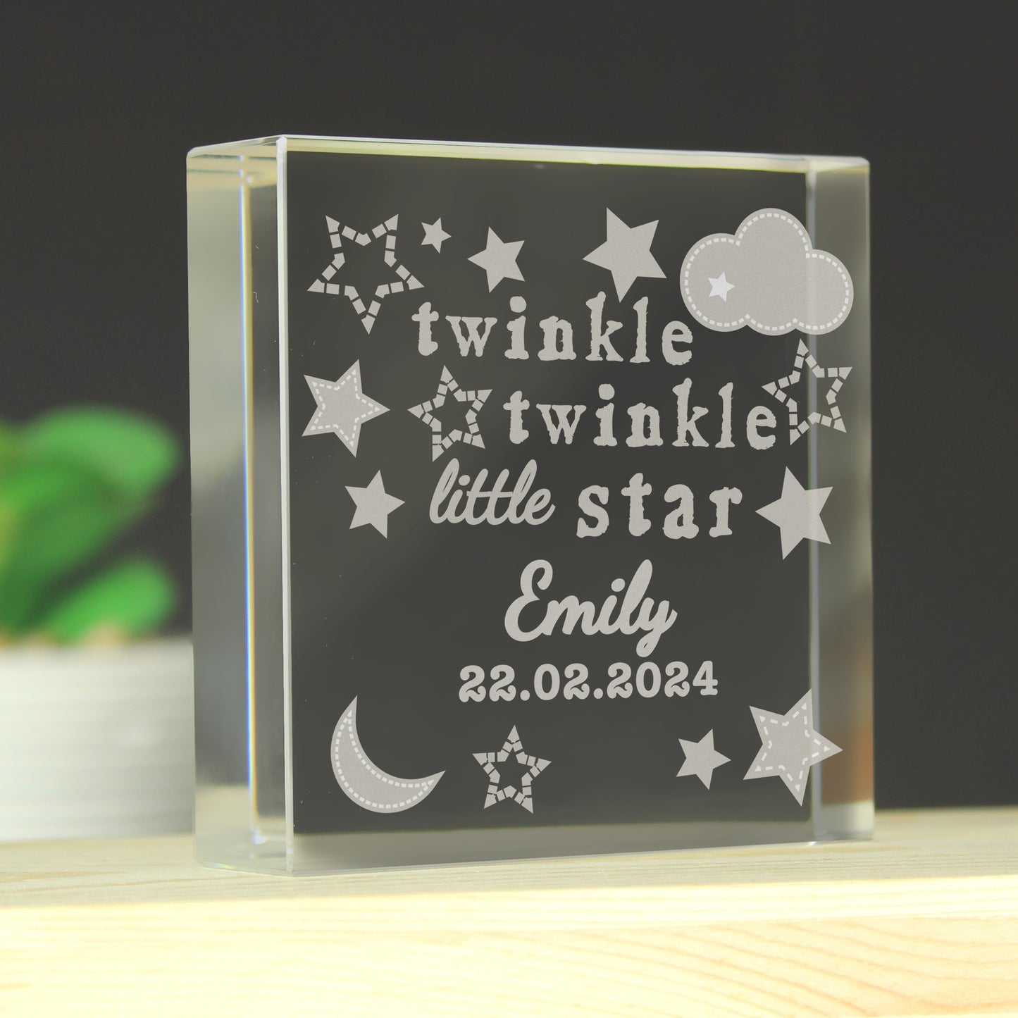 Personalised Glass block with engraved text 'twinkle twinkle little star Emily 22.02.2024' on a dark background