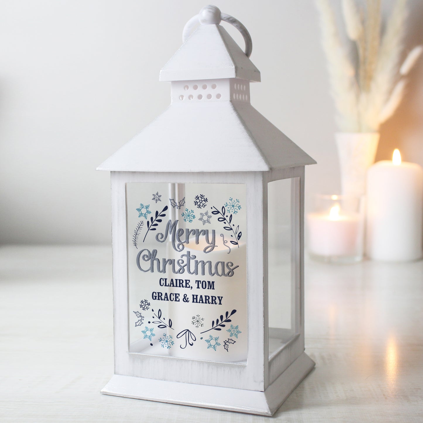 White lantern with 'Merry Christmas' message on a light background