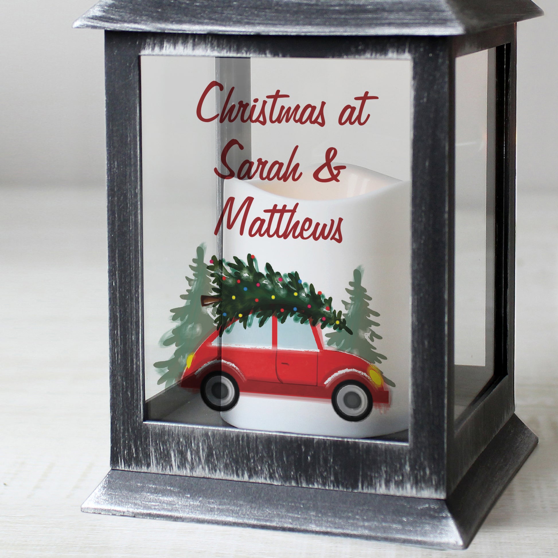 Decorative lantern with a Christmas scene and personalised text on a white background