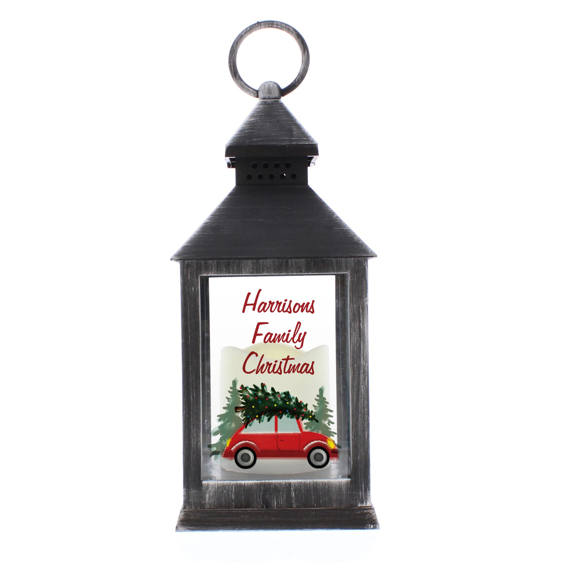 Decorative lantern with a Christmas design featuring a red car and tree, on a white background.