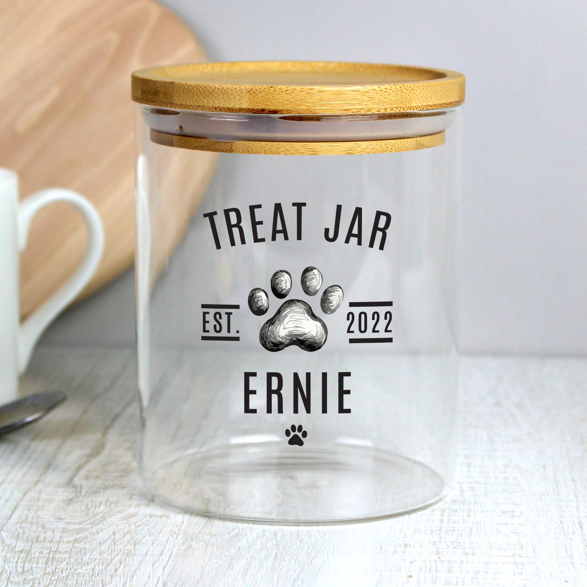 Clear treat jar with wooden lid, personalised with 'Treat Jar', 'Ernie', and paw print design.