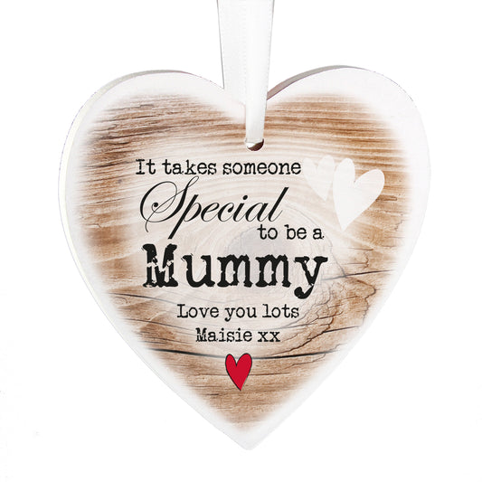 Heart-shaped wooden plaque with personalised text 'It takes someone special to be a Mummy' and a red heart on a white background.