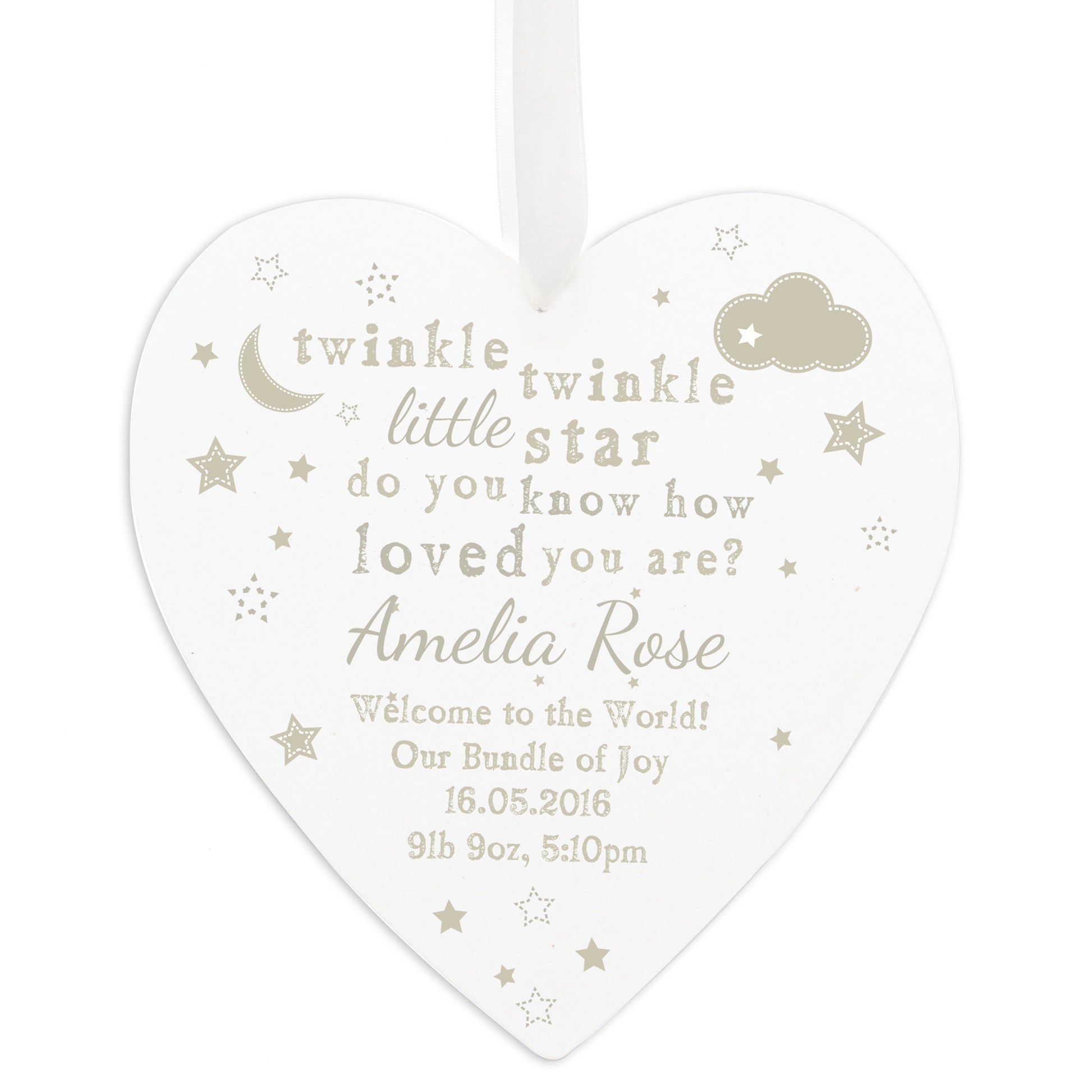 Heart-shaped decorative plaque with baby-themed text and graphics on a white background