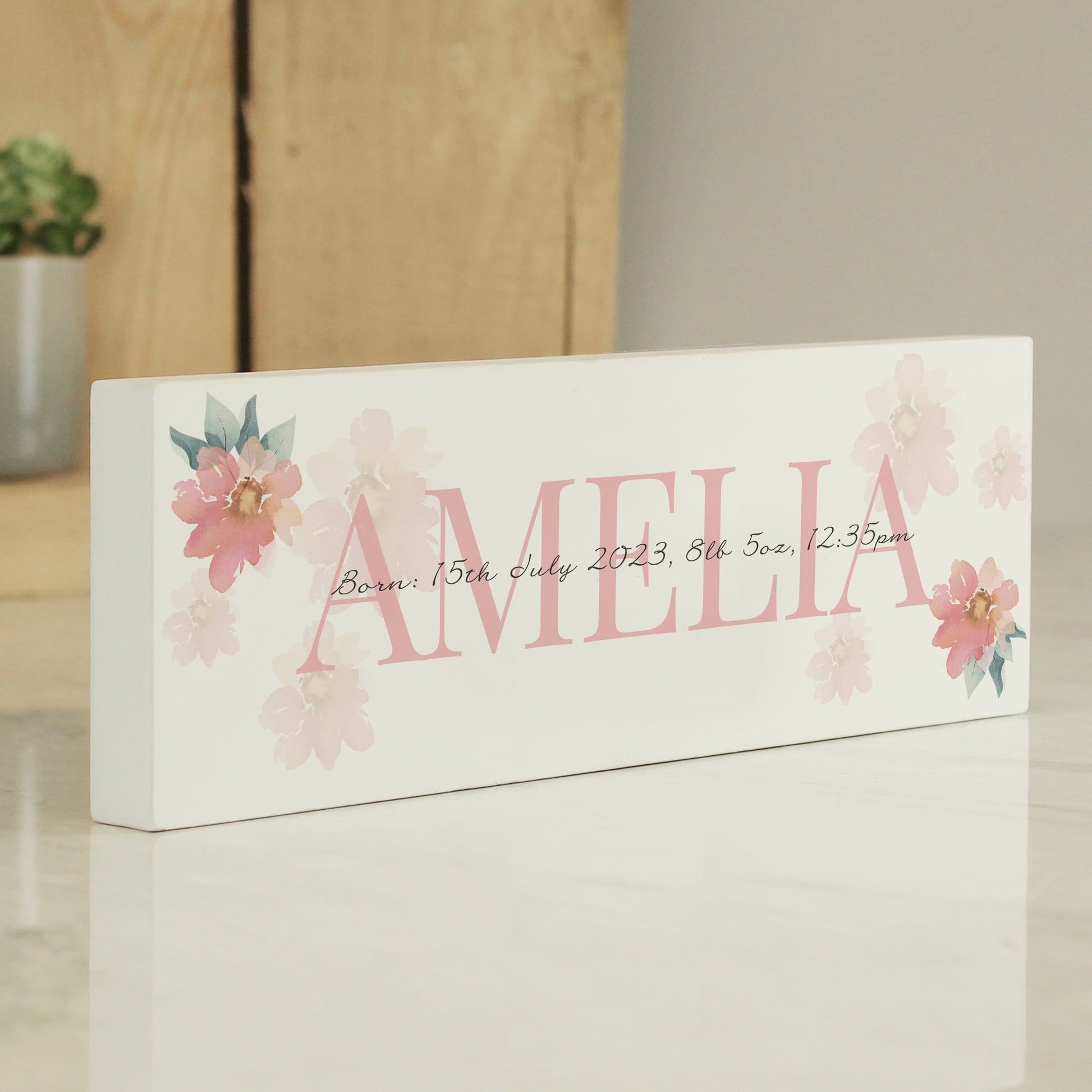 Personalised White decorative box with floral designs and the name 'Amelia' on a light background