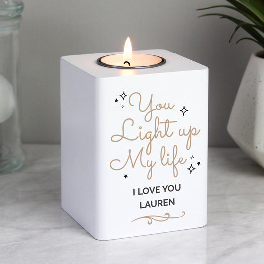 Personalised White candle holder with 'You light up my life, I love you Lauren' text, lit candle inside.