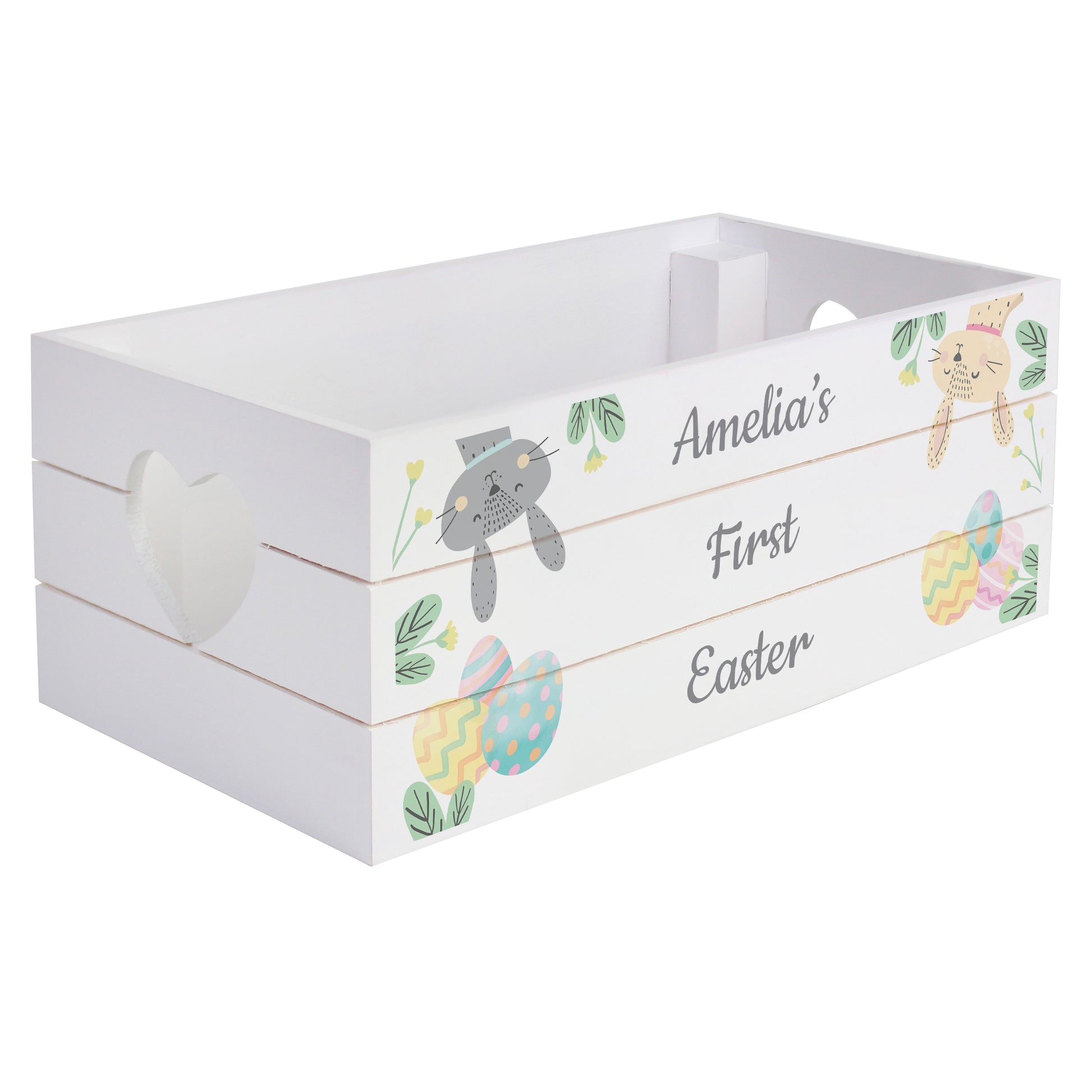 White wooden crate with Easter-themed decorations and 'Amelia's First Easter' text on a white background