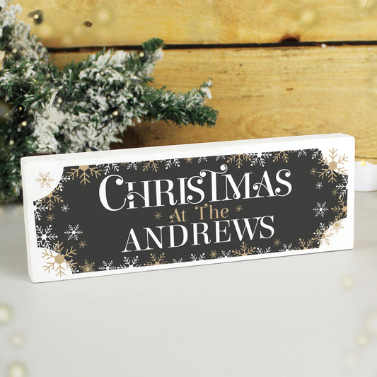 Personalised Decorative sign with 'Christmas at The Andrews' text in front of a Christmas tree.