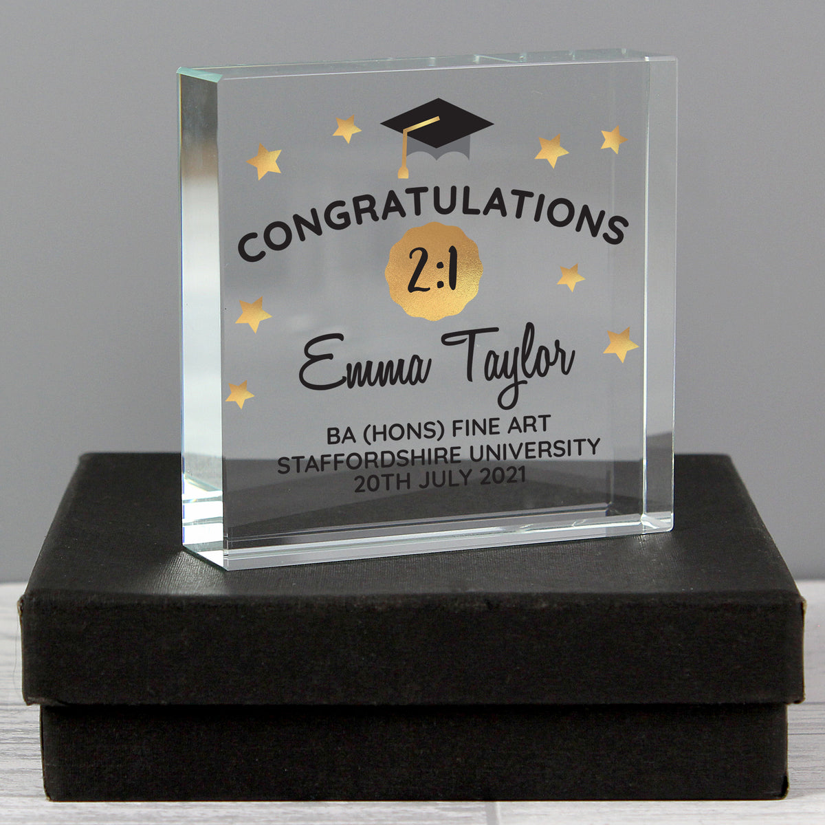 Graduation-themed glass award with personalised text on a black base.