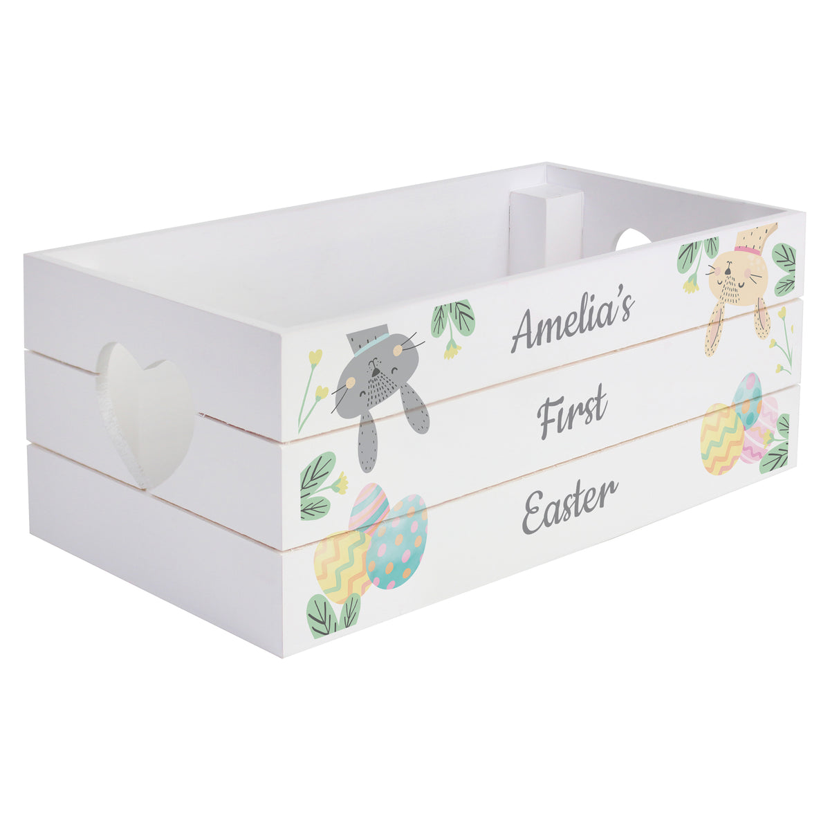 White wooden crate with Easter-themed decorations and 'Amelia's First Easter' text on a white background