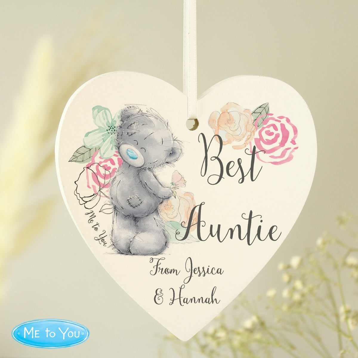 Personalised Heart-shaped hanging plaque with a teddy bear design and floral elements, featuring the text 'Best Auntie From Jessica & Hannah' and the Me to You logo.