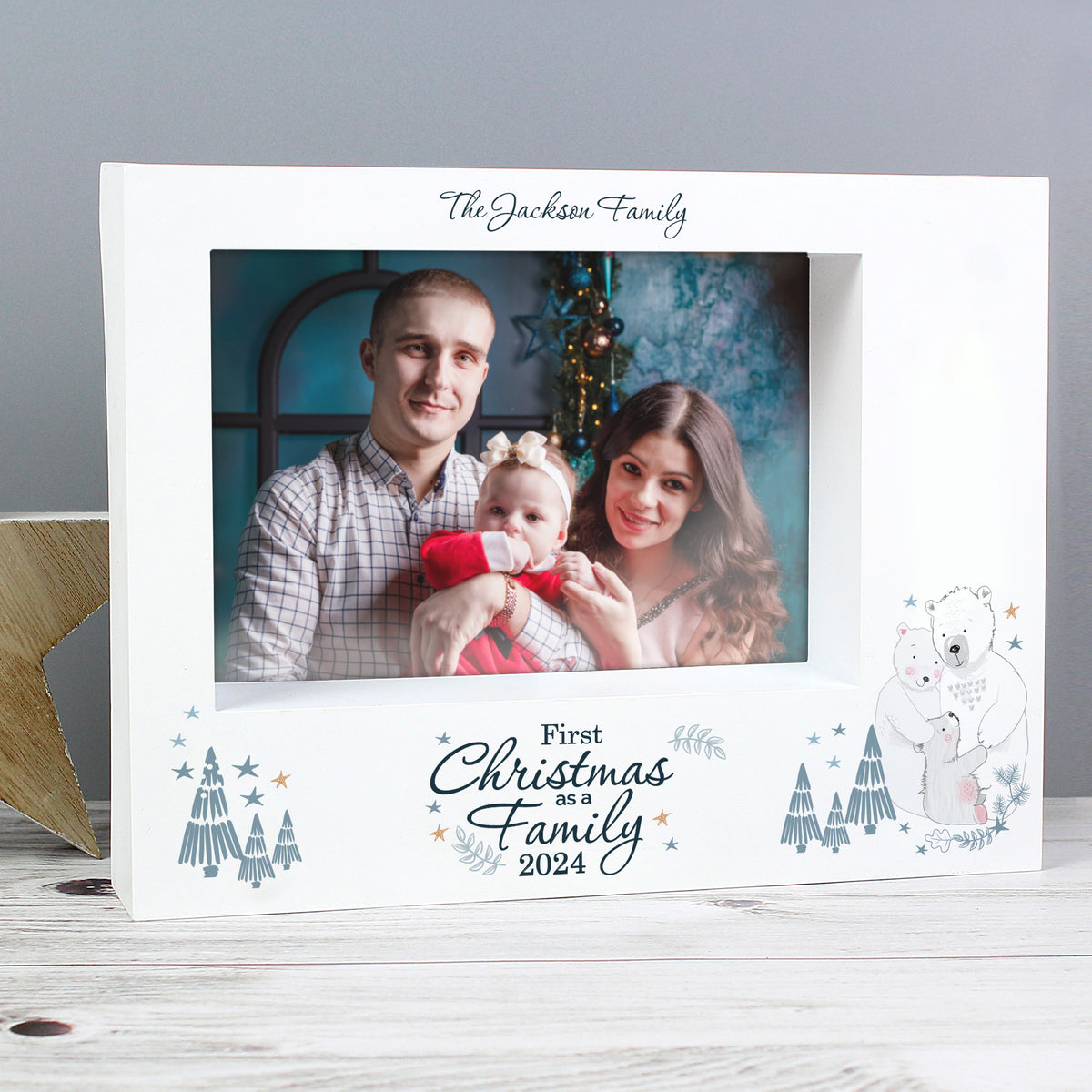 Personalised photo frame with a family photo and 'First Christmas as a Family' text.