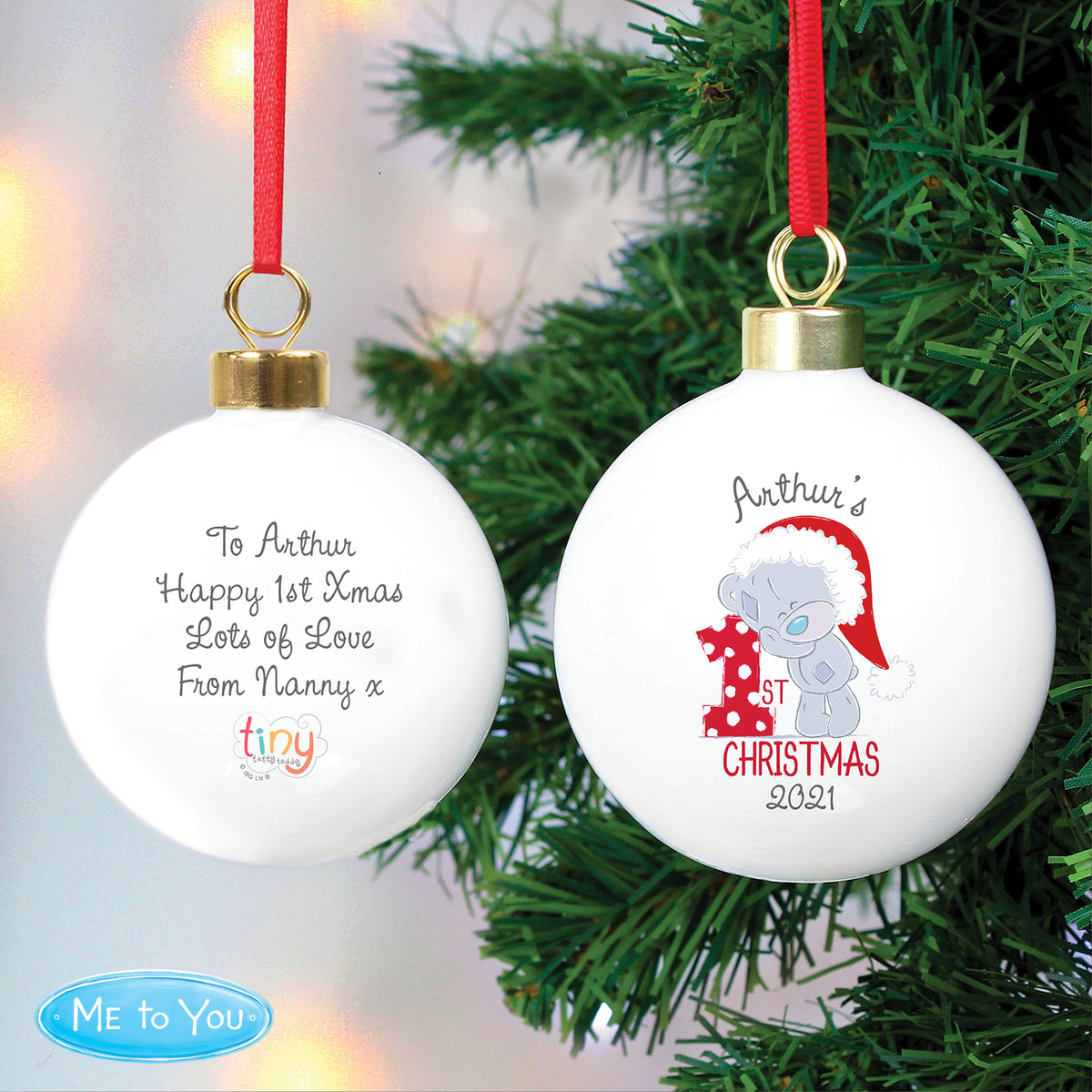 Two Christmas ornaments with personalised text on a tree background