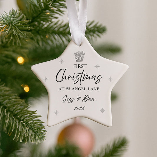Star-shaped ornament on a Christmas tree with personalized text