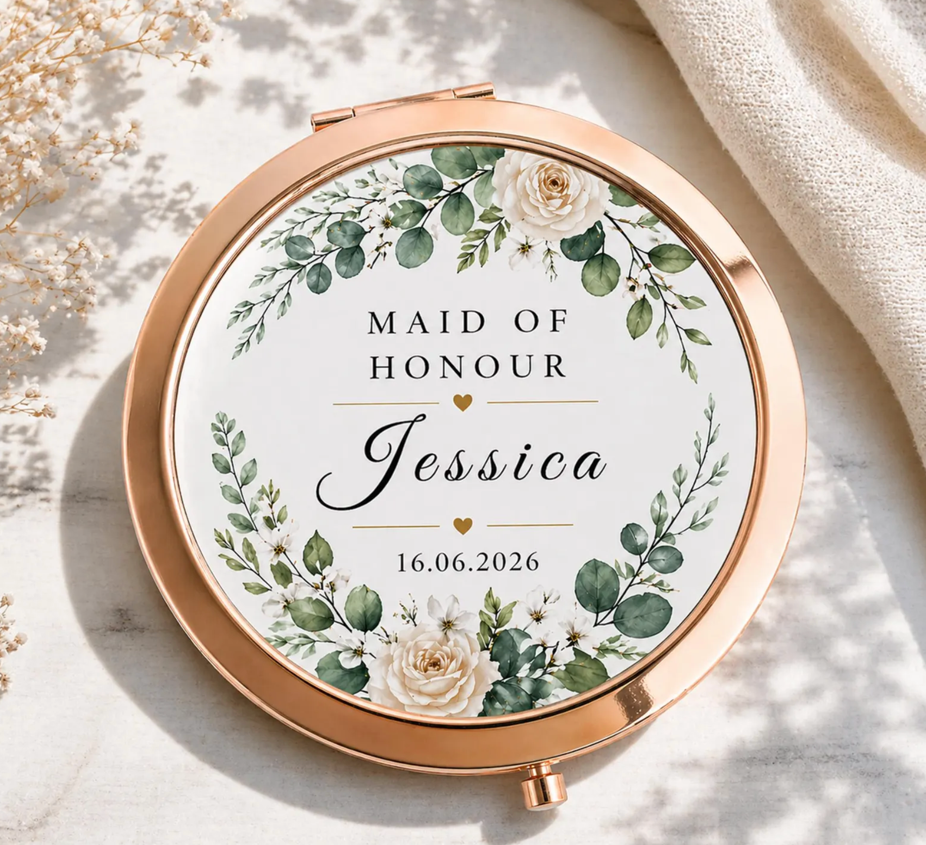 Compact mirror with floral design and text 'Maid of Honour Jessica' on a light background