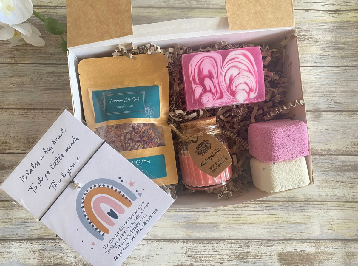 This Teacher hamper includes Himalayan rose salts, a hand-poured Midnight Rose candle, rose soap, two shower steamers and a Little Wish bracelet keepsake.

Featuring the meaningful sentiment “It Takes a Big Heart to Shape Little Minds,” it makes a thoughtful Teacher thank-you gift from an individual pupil or the whole class.