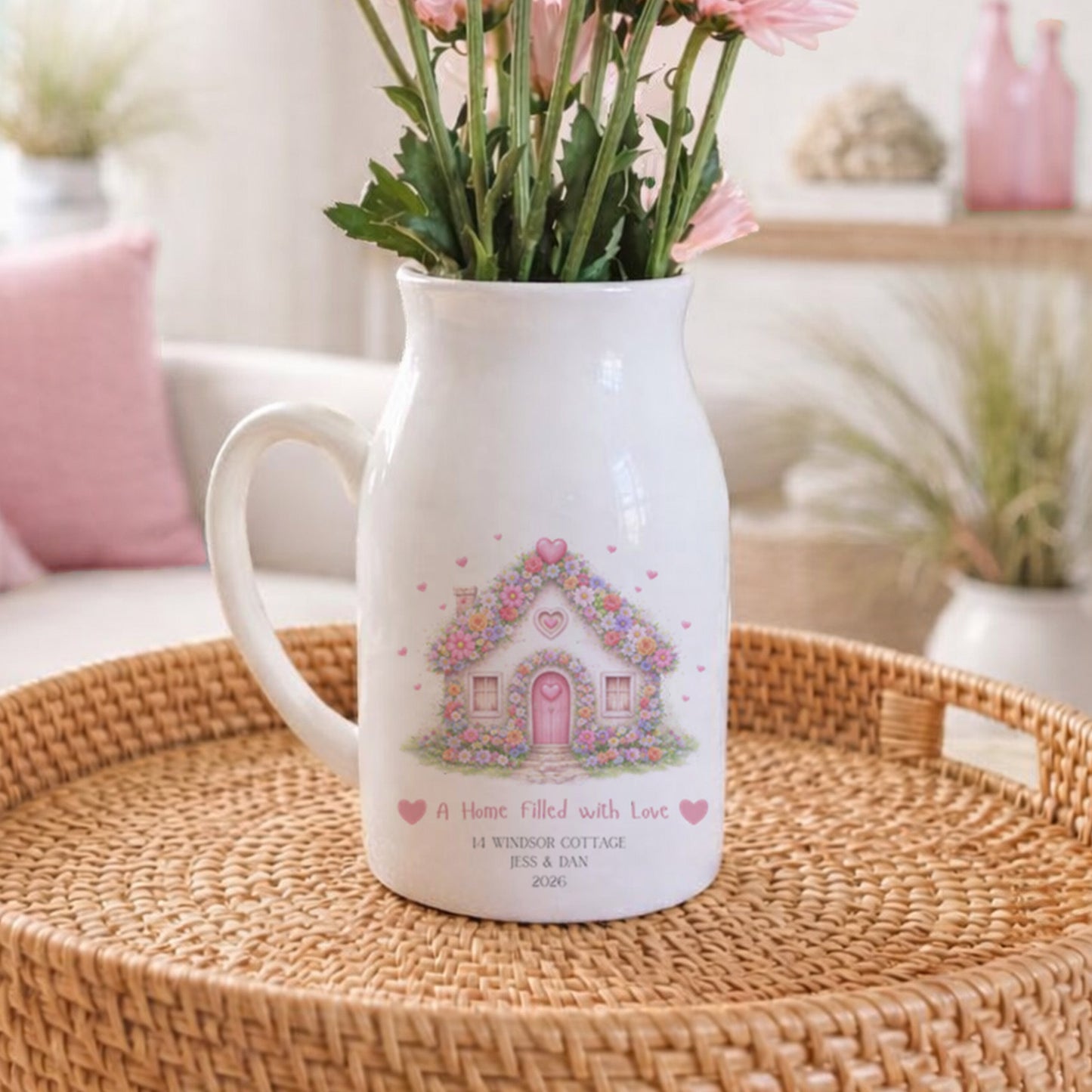 Personalised New Home flower pitcher jug with floral design on a woven tray in a cozy living room.