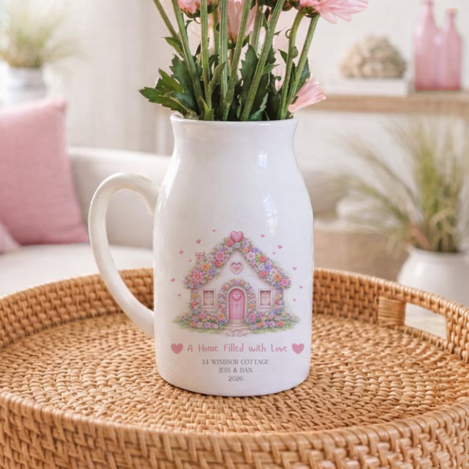 Personalised New Home flower pitcher jug with floral design on a woven tray in a cozy living room.
