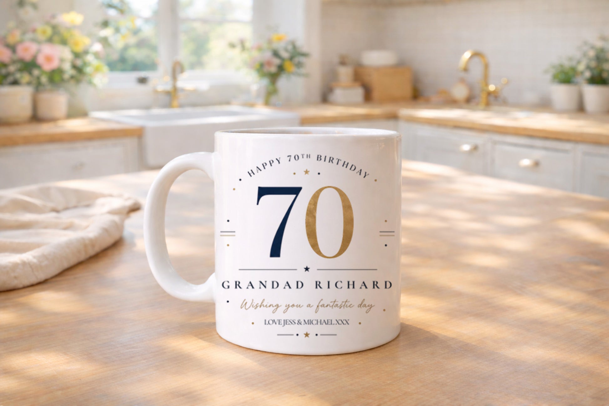 Personalised 70th birthday mug on a kitchen counter with decorative elements.