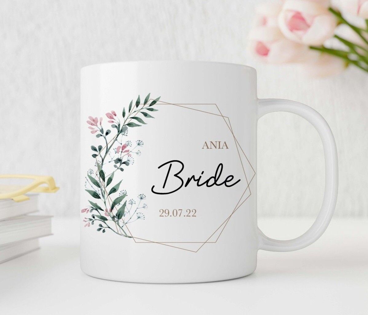 Personalised White mug with floral design and text 'Bride' and 'ANIA' on a light background