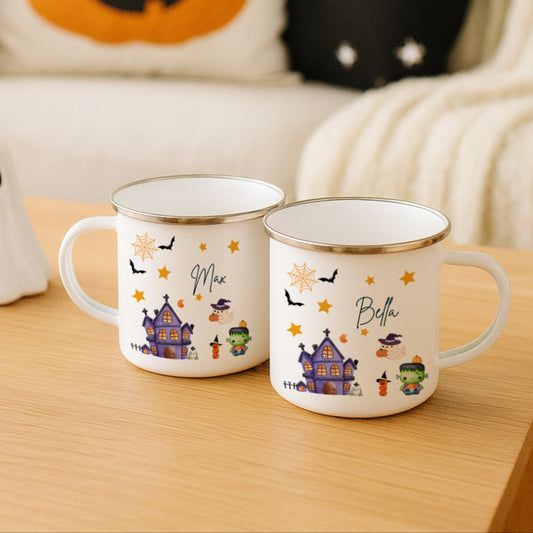 Two Halloween-themed mugs on a table with decorative pillows and ghost in the background.