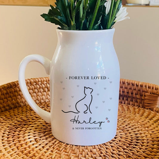 Cat Memorial Vase, White pitcher with floral arrangement on a woven tray in a home setting