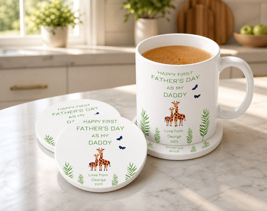 White mug and coasters with Happy First  Father's Day text and graphics on a kitchen counter.