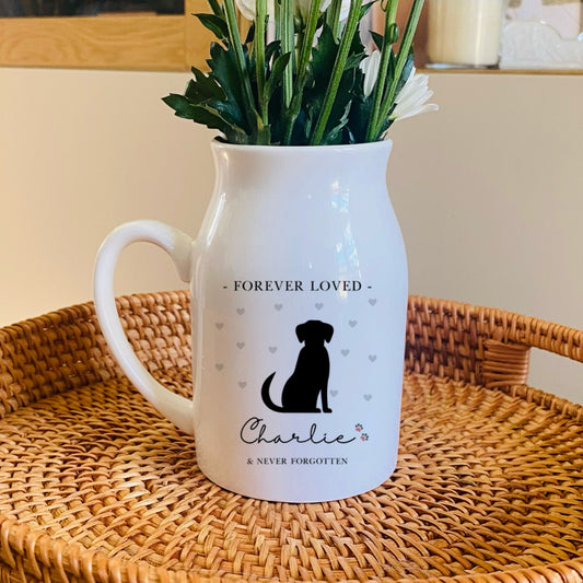 Dog Memorial Vase, White pitcher with 'Forever Loved Charlie' text on a woven tray with flowers