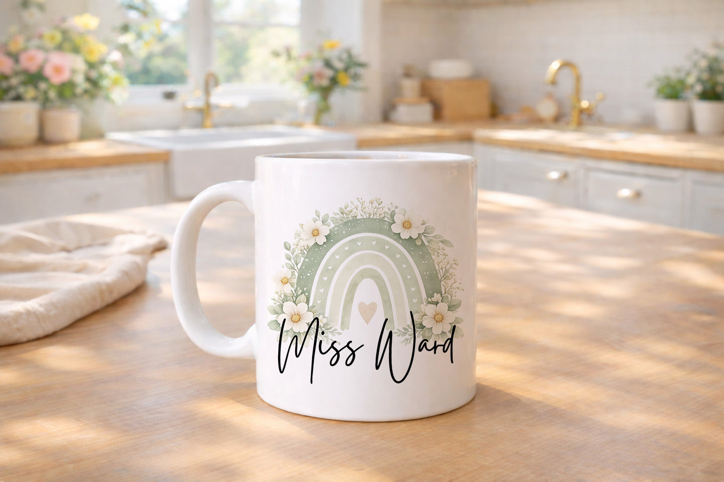 White mug with a rainbow and floral design on a kitchen counter