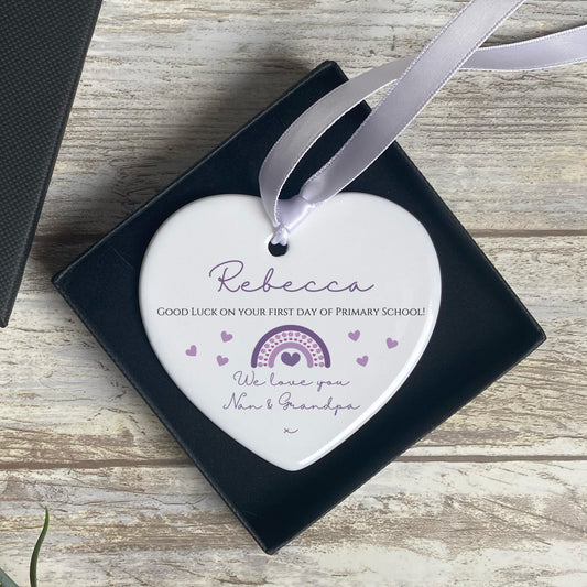 First Day of School Heart Ornament Keepsake. A hanging ornament with purple rainbow and writing.