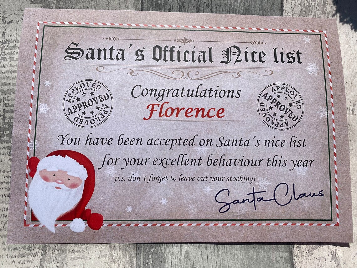 Personalised Certificate from Santa on a wooden surface, featuring text and a cartoon Santa Claus.