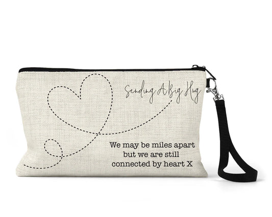 Pouch with heart design and text on a white background