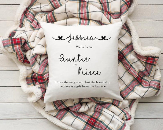 Pillow with personalised text on a plaid blanket