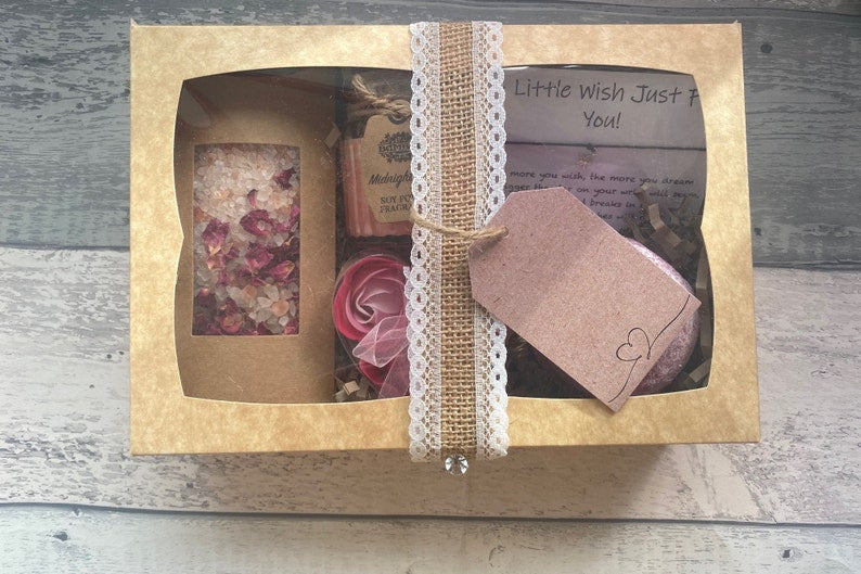 Gift box with decorative elements on a wooden surface