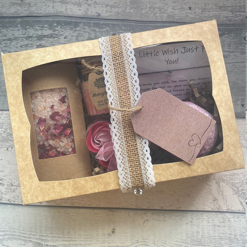 Gift box with decorative elements on a wooden surface