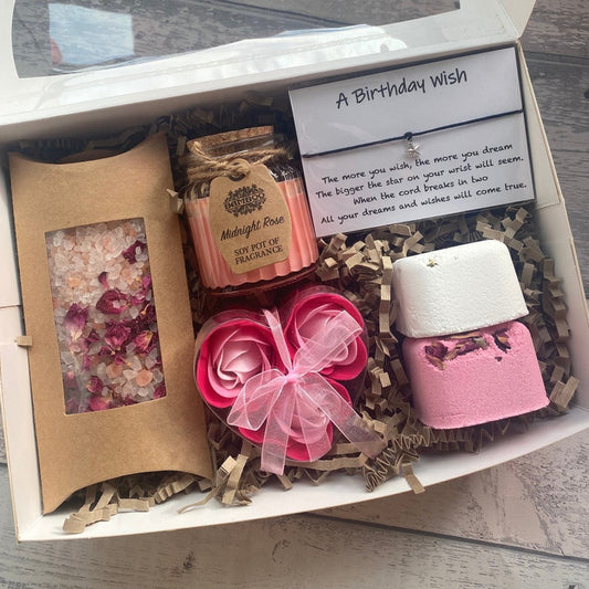 Gift set with candles, soap, and a card in a box