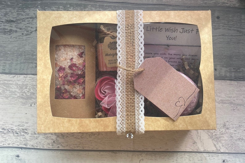 Gift box with decorative elements on a wooden surface