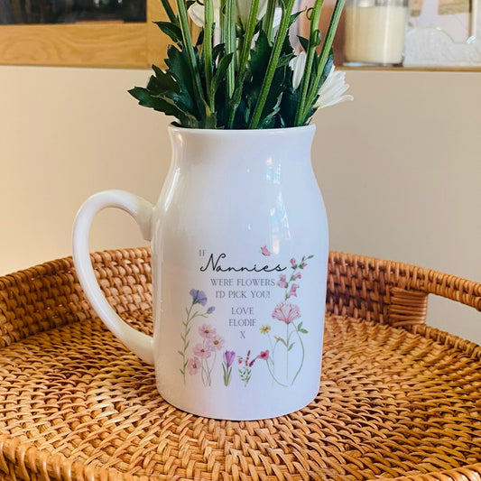 Personalised White vase with floral design on a woven tray. Personalised with 'If Nannies were flowers I'd Pick You'